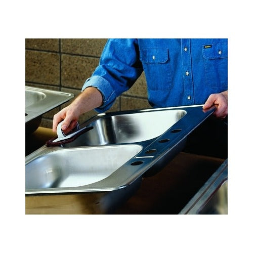 Scotch-Brite 8447 hand pad very fine aluminum oxide maroon shown polishing stainless steel sink surface abrasive hand pad